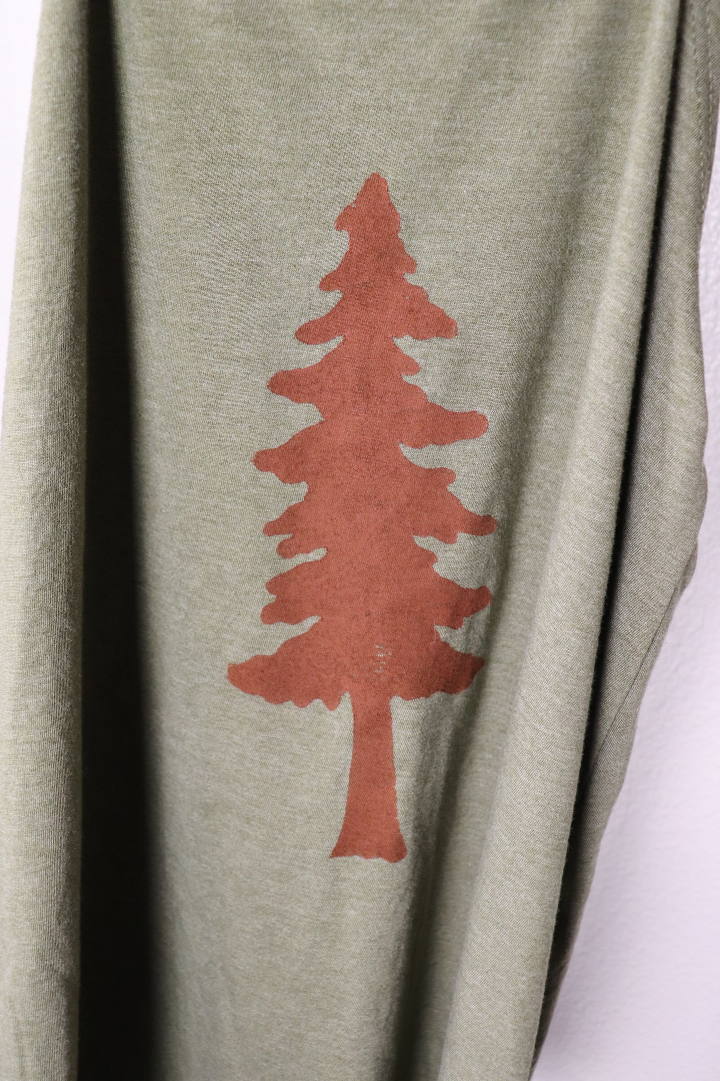 Tree stamp on green tank