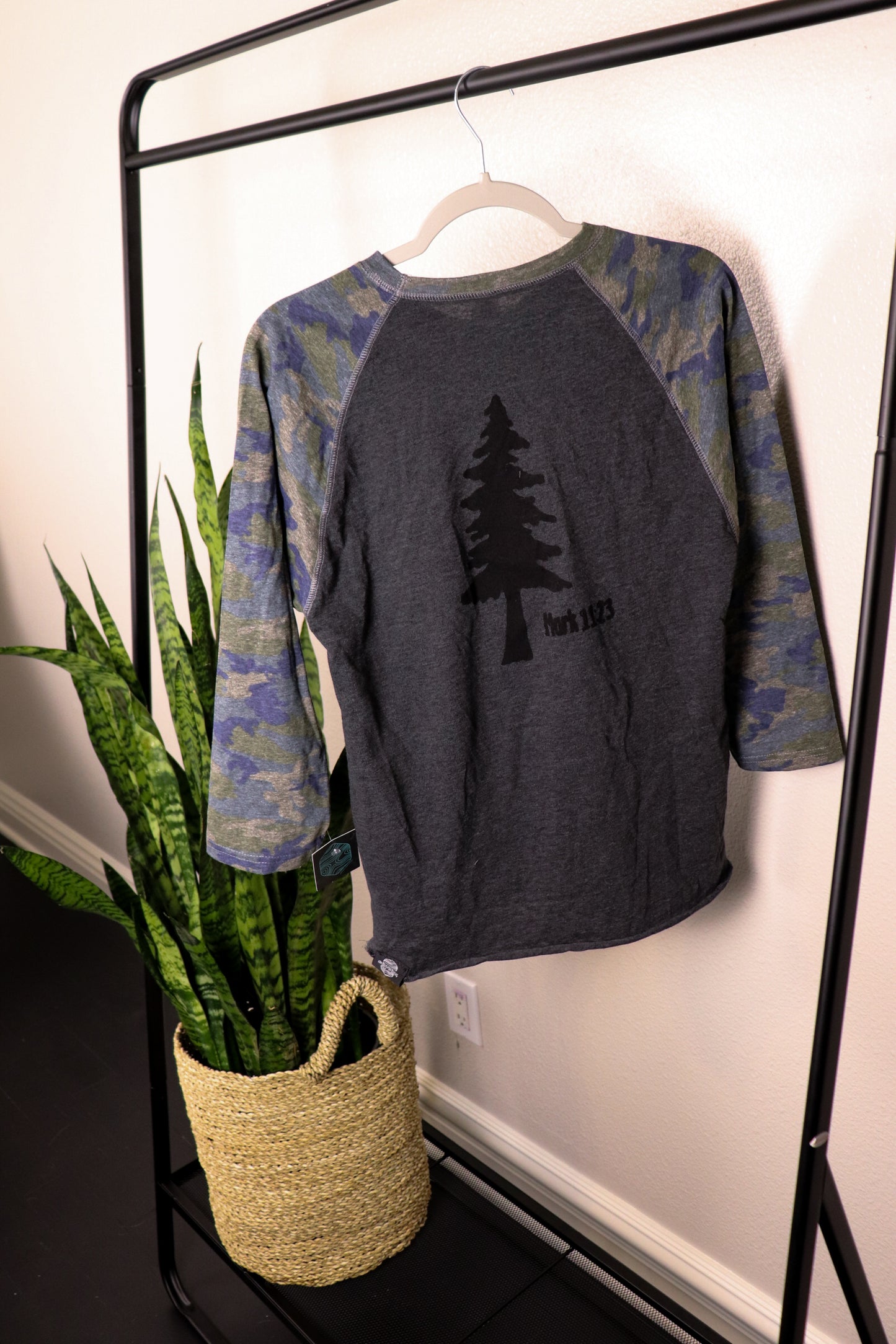 Gray T-shirt with 3/4 camo sleeves and black tree stamp with mark 11:23