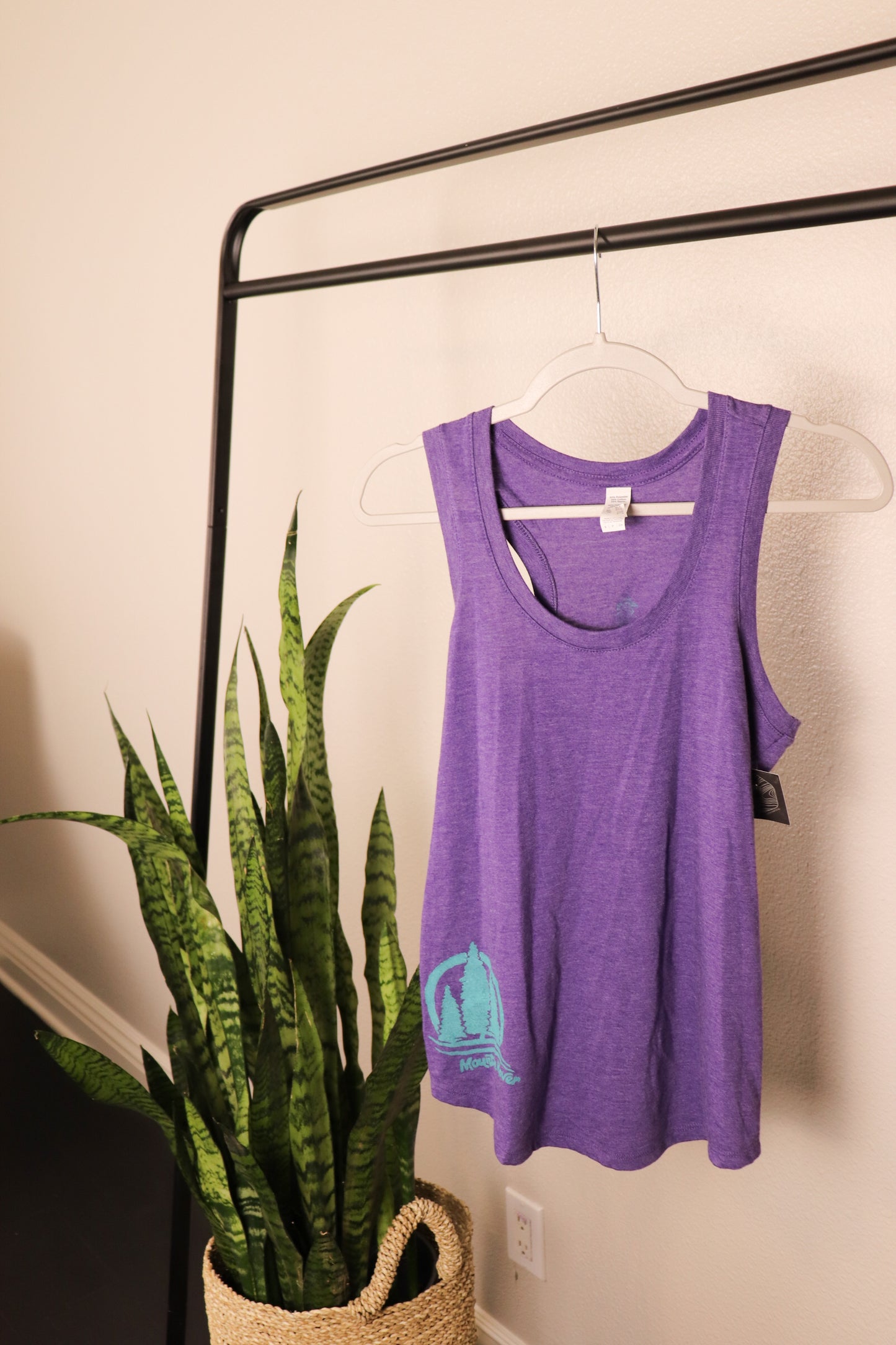 Purple racerback tank top with blue three tree stamp On the bottom right side