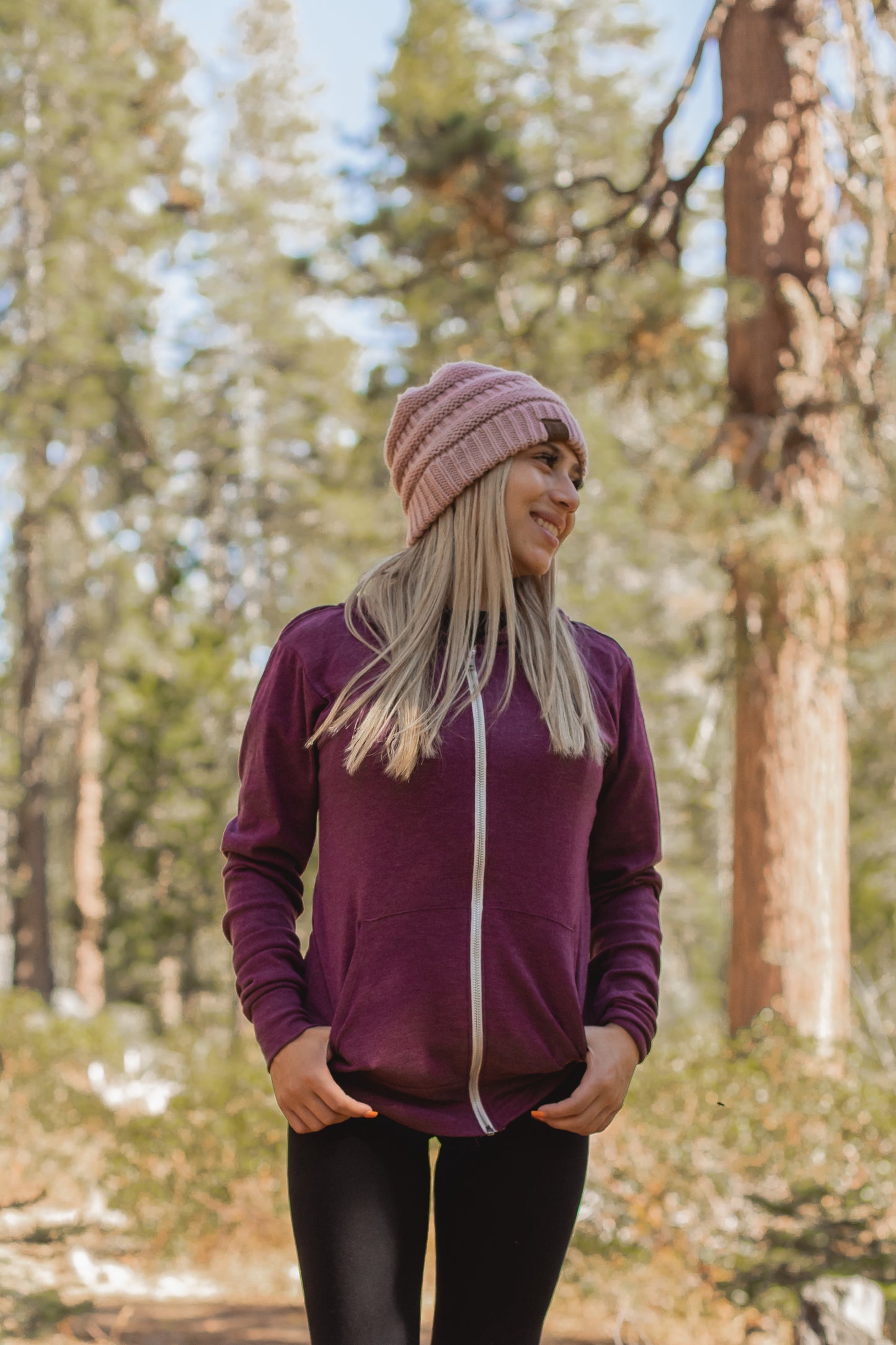 Woman in maroon zip up hoodie