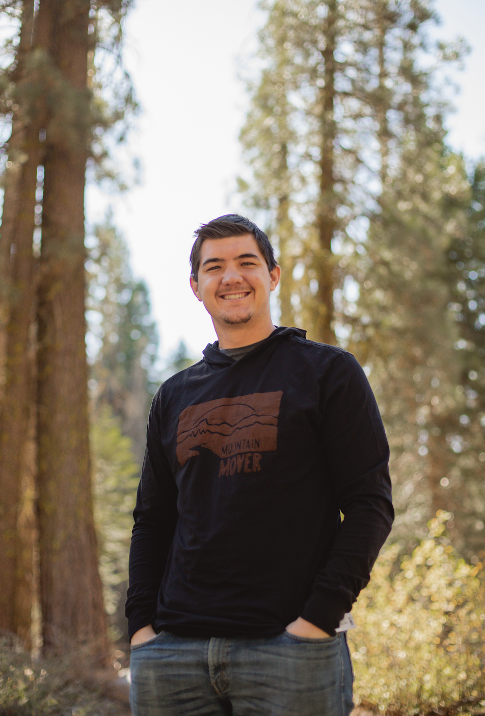 man in black mountain mover hooded long sleeve t-shirt